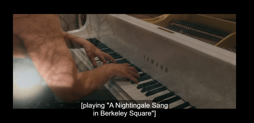 Screenshot from Good Omens Season One. The image is of a person playing a piano. The closed captioning says: [playing "A Nightingale Sang in Berkeley Square"]