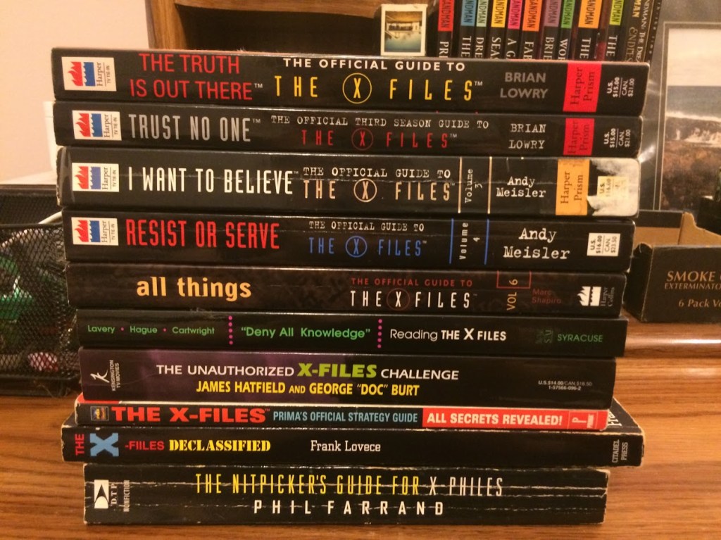 A stack of Behind The Scenes books about The X-Files.